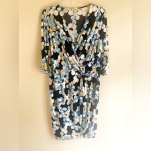 Wrap dress with waist brooch